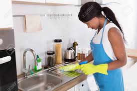Maybe you would like to learn more about one of these? African Young Woman Cleaning Kitchen Sink With Spray Bottle In Kitchen Stock Photo Picture And Royalty Free Image Image 92388619