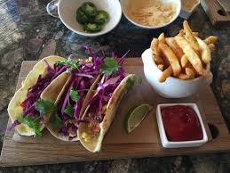 Lightly battered & fried fish served on a soft corn tortilla and topped with garlic sauce, lettuce, tomatoes, shredded cheese, cilantro, and feta. The Beach Club Grill Sarasota Restaurant Reviews Photos Phone Number Tripadvisor
