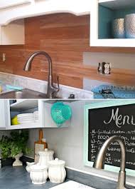 An even simpler diy kitchen backsplash idea is to cut larger sheets of patterned vinyl based on the size of your backsplash and cover the backsplash area anderson actually sells the backsplash on her etsy shop and has samples you can try for only a few bucks. Top 32 Diy Kitchen Backsplash Ideas