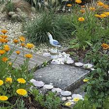 The addition of a shorter lamp in the bathroom is beautiful in the daylight and can function as a beacon of light for a night light. Coastal Beach Zen Garden Landscaping Ideas For A Seaside Experience No Matter Where You Live Coastal Decor Ideas Interior Design Diy Shopping