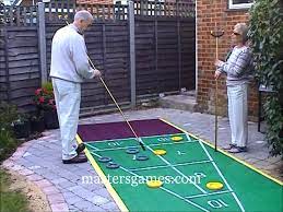 Shuffleboard, more precisely deck shuffleboard, and also known as floor shuffleboard, is a game in which players use cues to push weighted discs, sending them gliding down a narrow court, with the purpose of having them come to rest within a marked scoring area. Shuffleboard Youtube