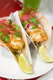 Maybe you would like to learn more about one of these? Golden Fried Cod Fish Taco Served With Parsley Red Onion Hollandaise Stock Photo Picture And Royalty Free Image Image 95192254