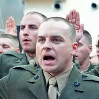 Marine Maj. Andrew Schilling speaks at a graduation
