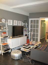 Ladder Shelves On Either Side Of Tv Table Allow For More Storage Without Feeling Like Shelves Are Overpow Small Living Rooms Home Living Room Small Living Room