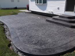 The concrete was stamped with an ashlar slate pattern and colored using light grey hardener with a charcoal release. Patios Walkways Gallery Real Help Custom Concrete Company Buffalo New York