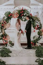 Use lush palms, exotic flowers, and conch shells to pull together a tropical wedding, and encourage guests to get into. Trending 28 Tropical Themed Wedding Ideas For 2020 Emmalovesweddings Tropical Wedding Decor Tropical Wedding Theme Wedding Ceremony Backdrop