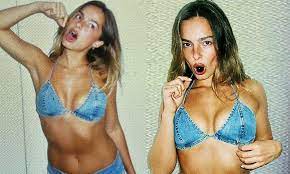 Addison Rae flaunts her toned body in a denim bikini top and matching short  shorts as she bites into a cherry for a cheeky post | Daily Mail Online