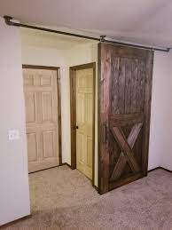 Ceiling Mounted Barn Door Without Paying A Fortune On The Hardware Thewoodentoolbox Rustic Farm Diy Barn Door Hardware Barn Doors Sliding Rustic Barn Door