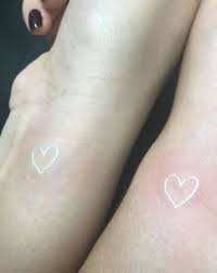 Matching White Ink Heart Tattoos By Mary Tattoo Heart Tattoo White Heart Tattoos Tiny Heart Tattoos Heart Tattoo