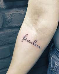 70 Tattoos That Prove How Powerful A Single Word Can Be One Word Tattoos Fearless Tattoo Small Words Tattoo