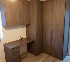 Beautiful rich hues and fine fabrics of almirah's collection is a promise of luxurious quality. A Corner Fitted Wardrobes With Study Table In Small Bedroom By Capital Bedrooms To Book Fitted Study Table Designs Study Table Bedroom Interior Design Luxury
