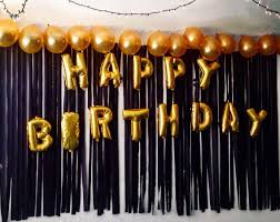 Black And Gold Backdrop Ideas Happy Birthday Balloons Taped On A Backdrop Of Black Streamers With Gold Balloons At Birthday Party Decorations Birthday Party Balloon Happy Birthday Balloons