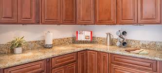 The regal oak solid wood kitchen cabinets enhance all kitchens with an elegant finish. Cherry Wood Kitchen Cabinets Corona Custom Kitchen Cabinets Summit Cabinets