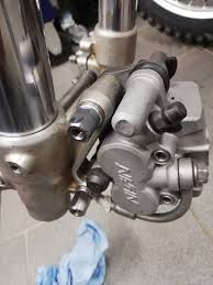 Homemade brackets for the brake disc cover.