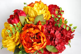 Nothing enhances a table like a beautiful floral arrangement. Silk Flower Arrangements Dining Table Arrangements Dining Table Centerpieces Peony Centerpiece Flower Centerpieces Orange And Yellow Floral Designs By Alka