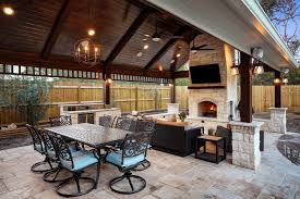 Gable Roof Patio Cover With Fireplace Kitchen And Travertine Tile Flooring Patio Patio Design Pergola