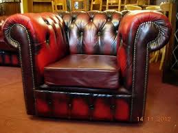 Matching pair of chesterfield club chairs in oxblood red. A Classic Chesterfield Club Chair Finished In Oxblood Leather 313791863