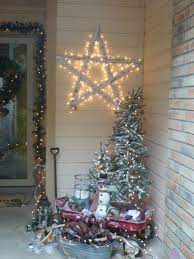 Christmas Decorations On The Porch Used My Old Red Wagon To House Two Small Lighted Christmas Outdoor Christmas Lights Christmas Porch Decor Christmas Lights