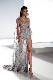 Oceana Tulle Asymmetrically Draped Gown Enriched With Multi Coloured Xilions And Crystals And Finished With Metallic Ch Fashion Fashion Dresses Couture Gowns