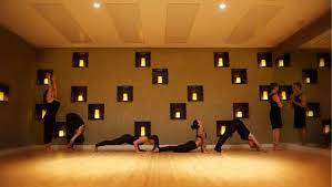 Wall Of Candles Yoga Studio Yoga Studio Design Yoga Studio Hot Yoga Studio