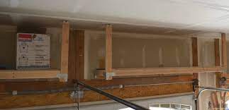 After installing the first one at 48 deep, i realized that was deeper than i wanted, so i made the second o. Diy How To Build Suspended Garage Shelves Building Strong