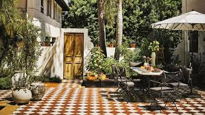 Garden mile® heavy duty 9kg garden parasol base umbrella stand round floral design bronze amazon home services experienced pros happiness guarantee. The Photo Worthy Rise Of The Outdoor Umbrella Architectural Digest