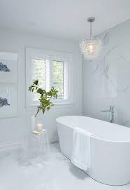 Master bathroom chandelier over tub. A Glass Bubbles Chandelier Hangs Over A Modern Oval Bathtub Paired With A Polished Nickel Tub F Luxury Bathroom Master Baths Bathroom Chandelier Modern Bathtub