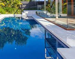 Stone pavers of different sizes and shapes were puzzled for this pool deck. Capri White Travertine Tiles And Pavers On Huge 2020 Sale