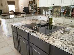 Alaska white is a pristine and elegant granite. Alaska White Granite White Cabinets Dark Island With Glass Tile Backspla Interior Design Kitchen Small White Granite Countertops Granite Countertops Kitchen