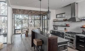 This clever wet bar boasts a stone countertop and backsplash that protects the entire sink area. Black Kitchen Island With Breakfast Bar Contemporary Kitchen