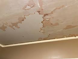 Bathroom ceiling damage from humidity and old paint?