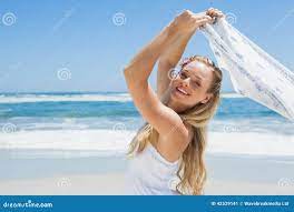 Pretty Carefree Blonde Posing on the Beach with Scarf Stock Image - Image  of woman, beach: 42529141