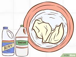 Be sure to test a small area of the clothing first to check it won't be affected by the vinegar. 4 Ways To Remove Coloring Washed In To Clothes Wikihow