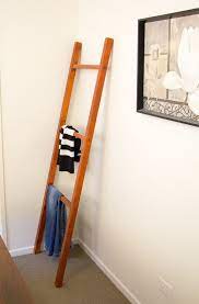 This idea creates an industrial, yet good news! How To Make A Diy Clothing Ladder Rack Step By Step Diy Clothes Rack Diy Ladder Woodworking Projects That Sell