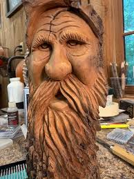 What do you think of the man in the sun carving?