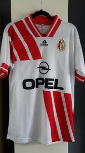 The german manufacturer taking over the les rouches' contract from new balance sees the belgian jupiler pro league side receive a relatively plain red shirt with white neck, cuffs and partner branding. Standard Liege Fora Camisa De Futebol 1993 1994 Sponsored By Opel