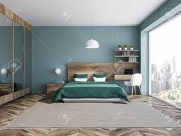 Maybe you would like to learn more about one of these? Interior Of Stylish Bedroom With Blue Walls Wooden Floor Green Stock Photo Picture And Royalty Free Image Image 109497917