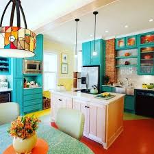 10 Colorful Kitchens That Buck The All White Trend Bold Kitchen Kitchen Colors Teal Kitchen