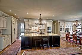 Look at the book matching! Painted Kitchen Featuring Oversized Black Island Traditional Kitchen Other By Kirkland Cabinets And Innovations Houzz