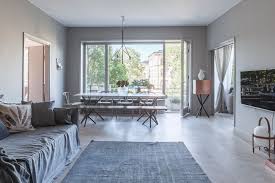 Centre modern furniture around a cubic rug. Muted Grey Marble And Copper Nordic Design