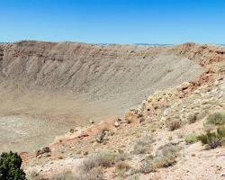 Image of meteorite crater with a smoking meteorite in the center
