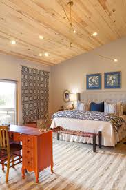 French country and old world style aren't complete without rustic farm accents and hand forged iron accents. French Country Bedroom With Natural Wood Ceiling Hgtv