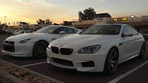 2013 Bmw M6 Next To A 2010 Nissan Gt R