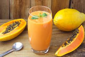 Premium Photo | Homemade papaya smoothie with tropical fruits and mint in glass  cup over rustic wooden table. top view