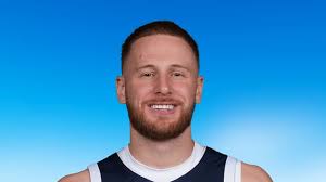 Donte DiVincenzo is being helped off the floor, barely …