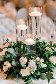I was also super happy with my centrepieces and chair covers for our reception. Floating Candles Budget Friendly Wedding Centerpiece Ideas Emmalovesweddings