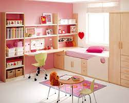 Inspiration for a scandinavian kids' room for girls in dallas with pink walls and light hardwood floors. Bedroom Sweet Decorating Ideas For Girls Bedroom With One Study Table Cozy Inspiration Decorating Pink Bedroom Design Girl Bedroom Decor Pink Bedroom For Girls