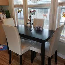 Dark finish and minimalist design make this table the epitome of contemporary decor. Kimonte Dining Table Ashley Furniture Homestore