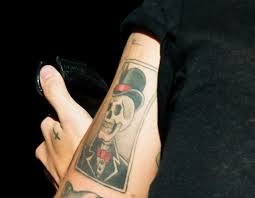 Harry styles loves him some cross tats. The Meaning Behind Harry Styles Tattoos Harry Styles Tattoos