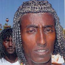 Ethiopian Tribesman Of The Afar Nation Applies Butter To His Beautiful Gray Coils Butter Is Part Of Regu African Hairstyles Black History Facts African Beauty